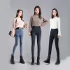 The new grey-black leggings for women's outerwear in autumn and winter 2022 are high-waisted, slimming, elastic, tight and petite. They are long and fleece details Picture